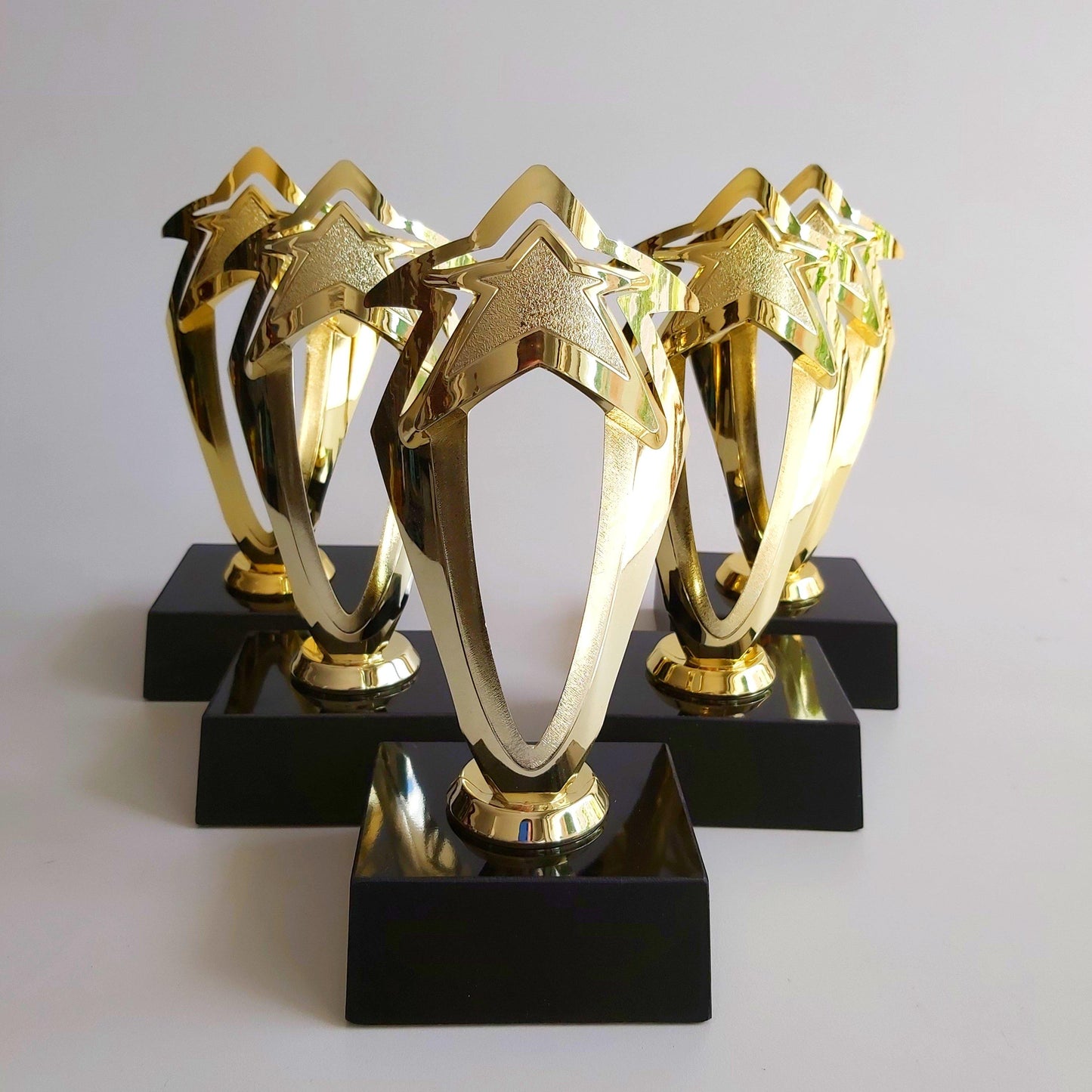 trofeo dorado estrella plastico